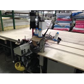 Mattress panel hemming machine with ventilated table